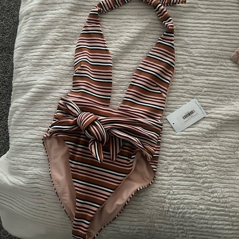 Montce tie up one piece. Brand new with tags on, never worn.